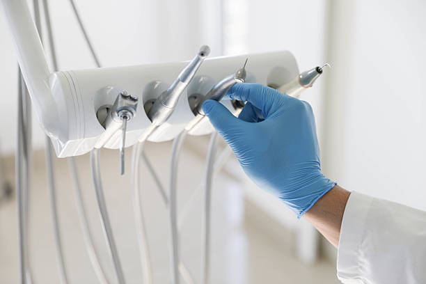Professional Tooth Extraction technician working in St. Pauls, NC